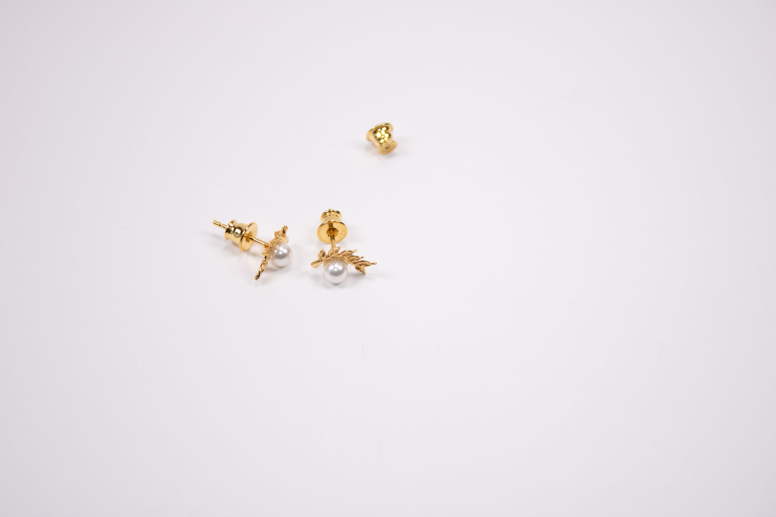 Product image of FredFloris small stud gold plated silver pearl earrings